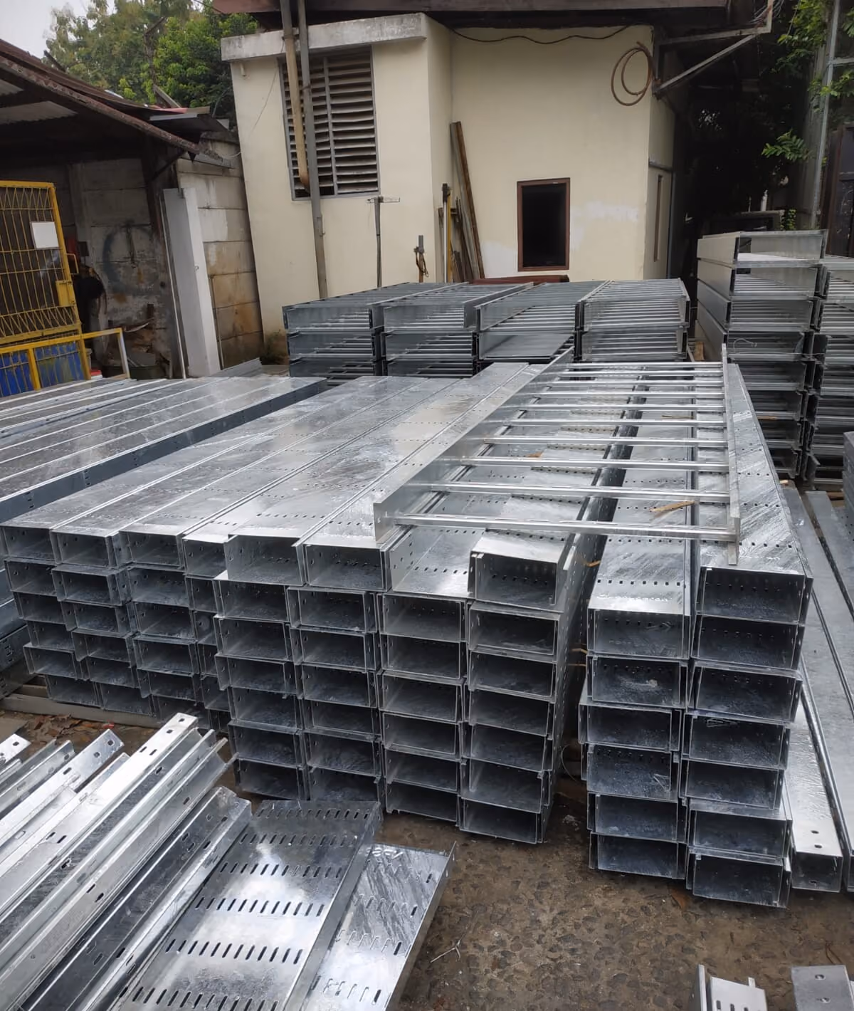 Perforated cable tray and cable ladder stock in the warehouse yard
